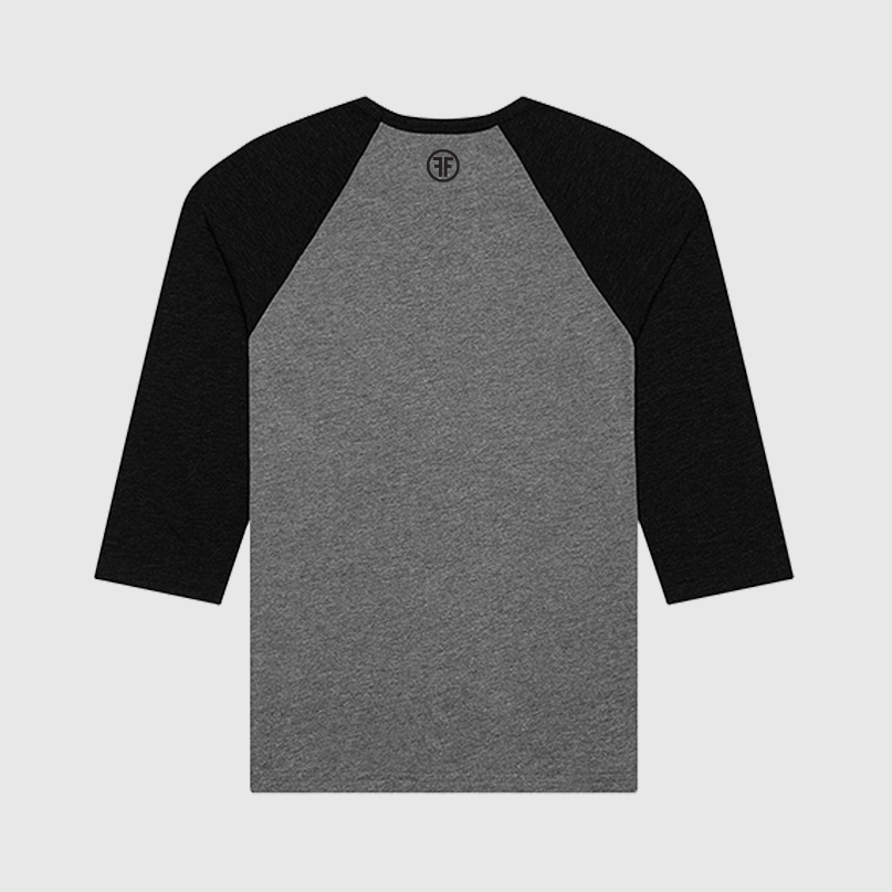 The back of a grey baseball equality t-shirt that has black arms and collar. A black logo is below the collar, with two Fs back to back in an aqua circle.
