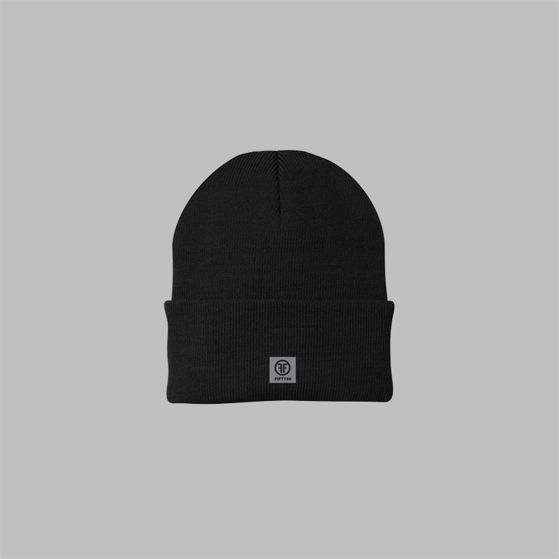 A black beanie with a rolled up cuff. It has a white embroidered logo with two Fs, back to back, outlined by a circle, on the left front.