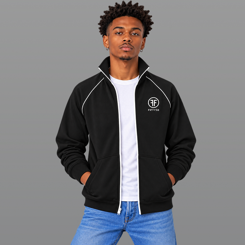 Man wearing a black jacket with a white zipper and white piping on the front of the shoulders. White embroidered left chest logo, has two Fs back to back outlined by a circle. 