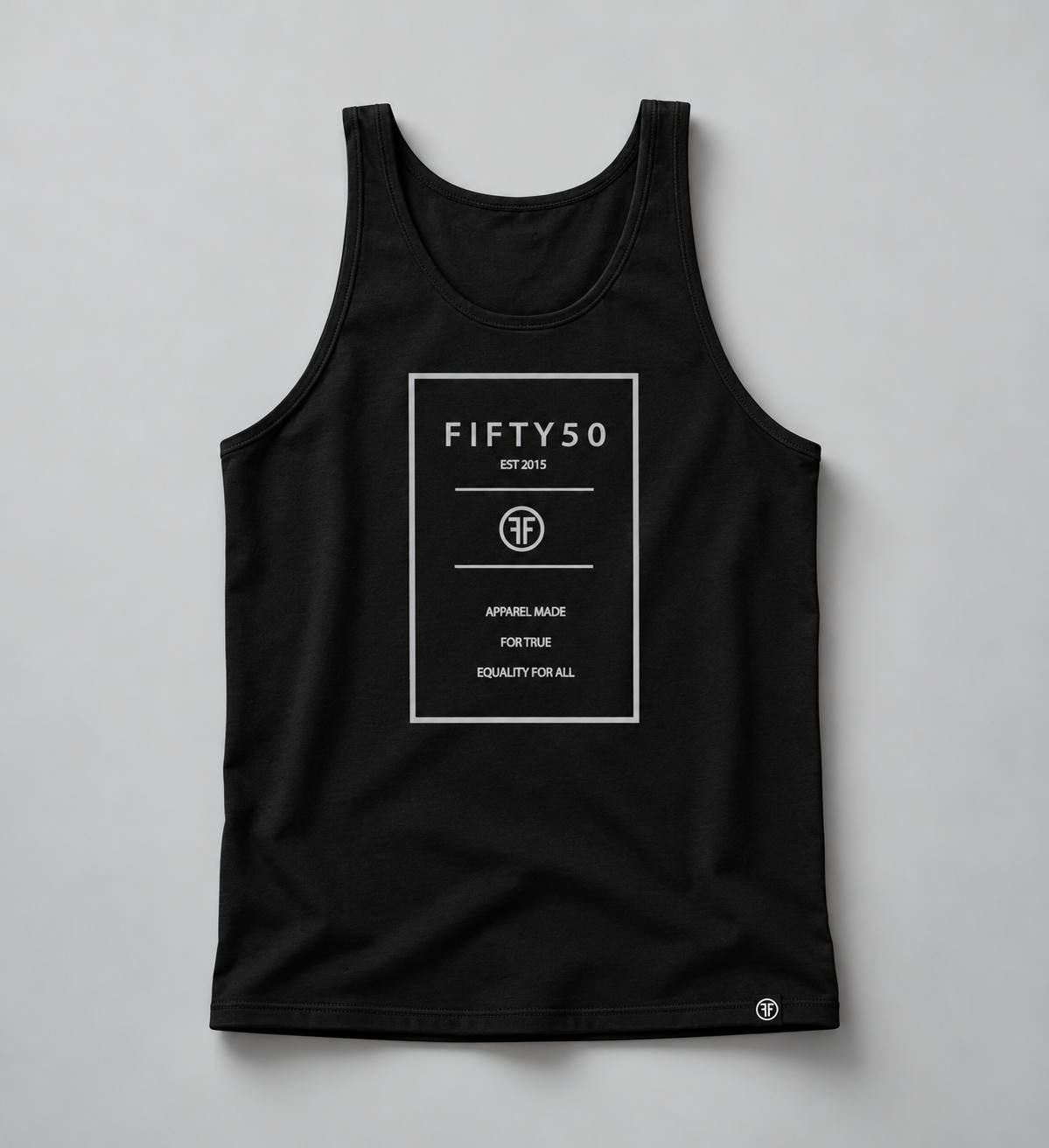 A black tank top with a studio light grey background. The graphic is a the thin outline of grey rectangle with text inside it, that reads 'Fifty 50 Apparel Made For True Equality for All'