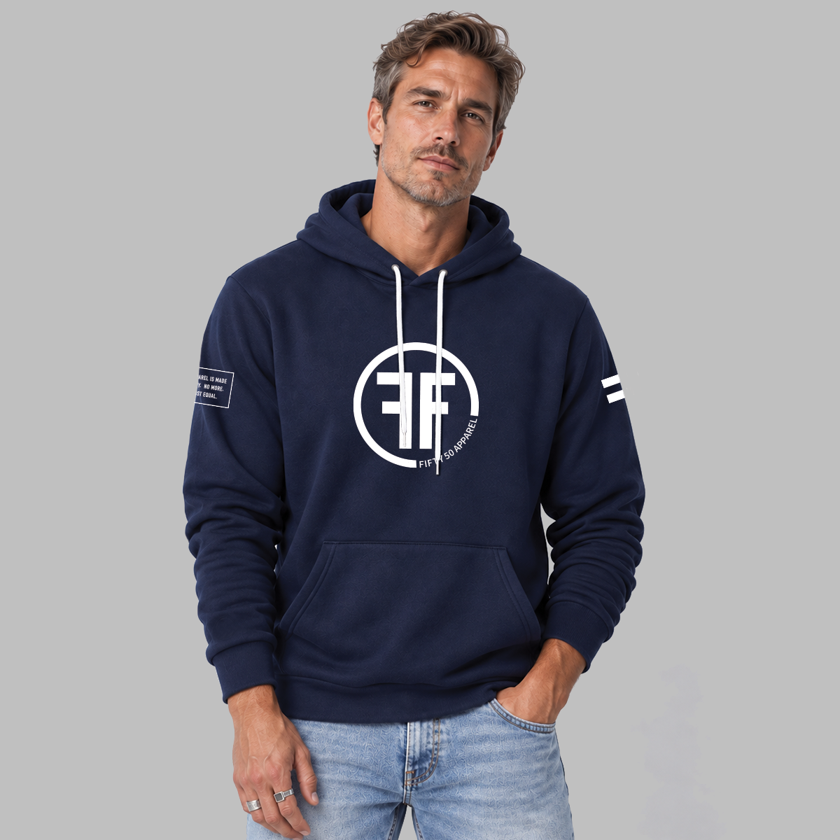 A man wearing a navy blue equality hoodie with a white equal sign on left arm, and the text, 'Fifty 50 Apparel is made for equality, no more, no less, just equal', on the right arm. Center chest logo has two Fs, back to back outlined by a circle.