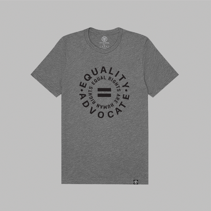 A heather gray short-sleeve t-shirt with a black circular graphic on the chest reading 'EQUALITY ADVOCATE, EQUAL RIGHTS ARE HUMAN RIGHTS' around an equal sign, shown flat against a solid gray background.