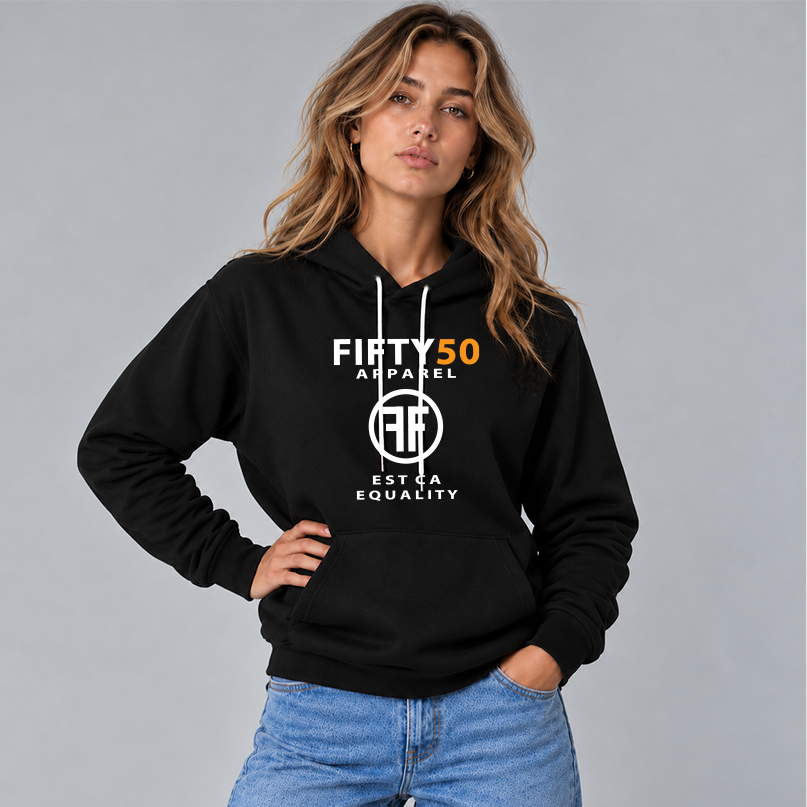 A woman wearing a black lgbt hoodie with the text, Fifty 50 Apparel and Est Ca Equality in white, bold font. The 50 is in orange ink and the center of the logo has two Fs, back to back in a circle.