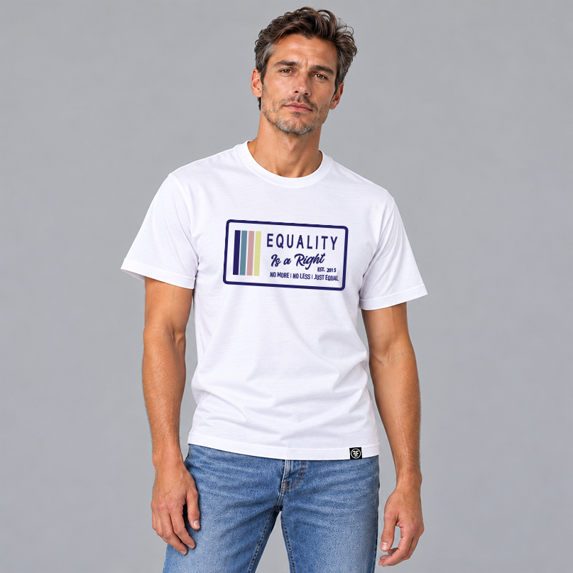 A man wearing a white graphic t-shirt with a navy, stone blue, pink and yellow design that says 'EQUALITY IS A RIGHT' 'NO MORE NO LESS JUST EQUAL' paired with blue jeans, set against a solid gray studio background.