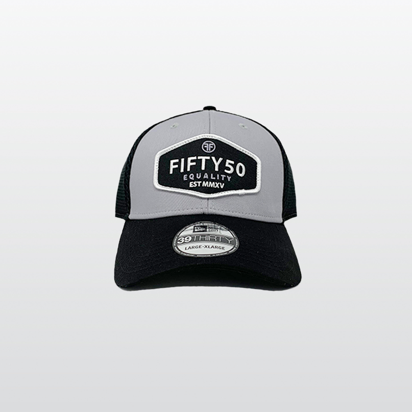 An equality fitted hat with a grey front, and a black bill and mesh sides. The sewn on black patch has the text in white, bold font, Fifty50, Equality and the date, 2015, in Roman numerals.