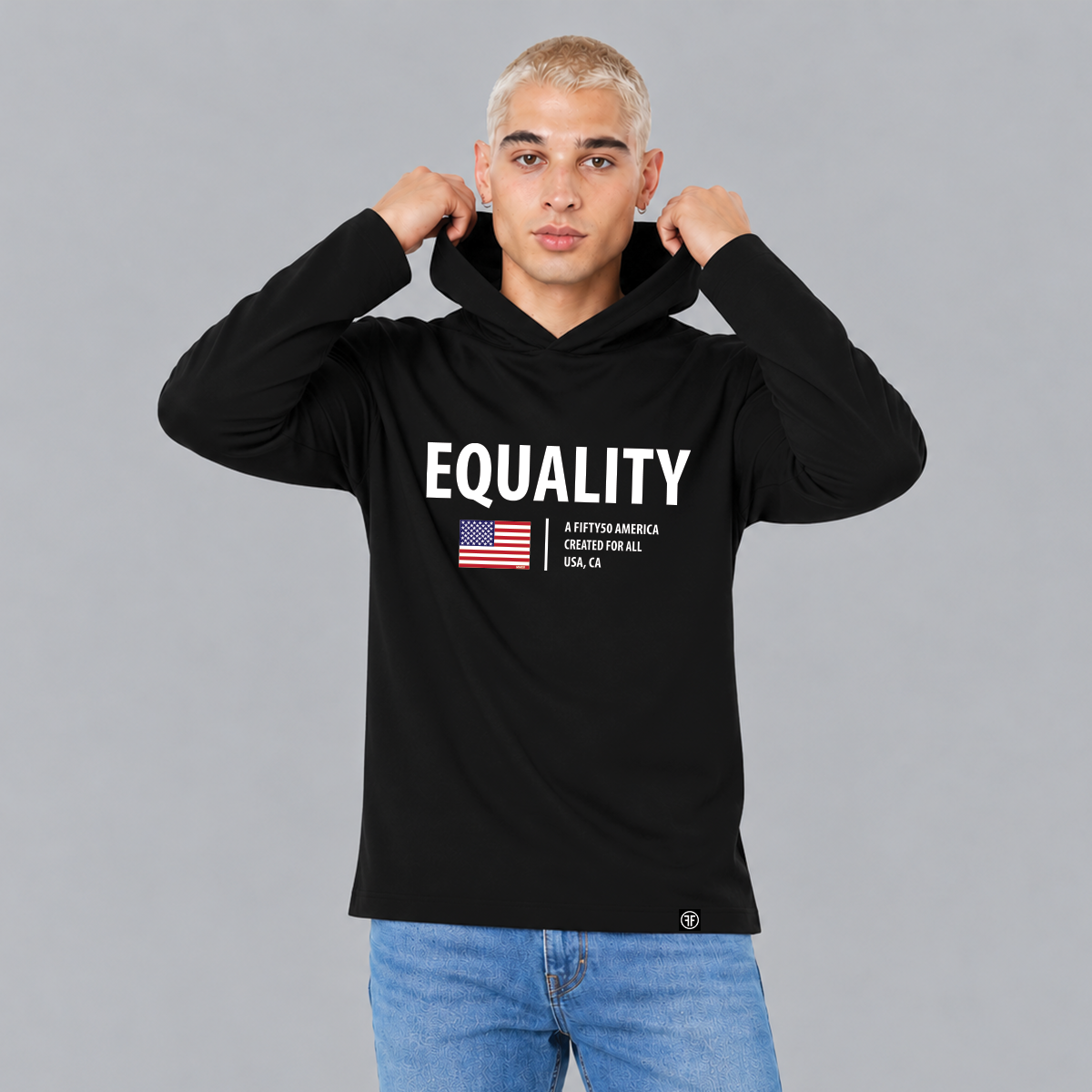 A man wearing a black jersey hoodie, with  the text, 'Equality', written in white bold font. Under that there is an American flag and the text, 'A fifty 50 America created for all'.