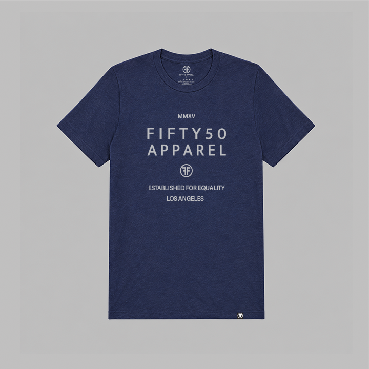 A navy blue heathered short-sleeve t-shirt with light grey printed text reading 'FIFTY50 APPAREL' and 'ESTABLISHED FOR EQUALITY LOS ANGELES' on the front, displayed flat against a solid gray background.