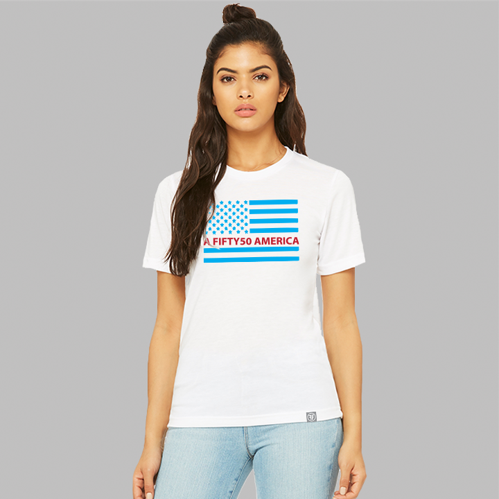 A lady wearing a white equality t-shirt with a large American flag. The flag is in turquoise and red with the text, A Fifty50 America.
