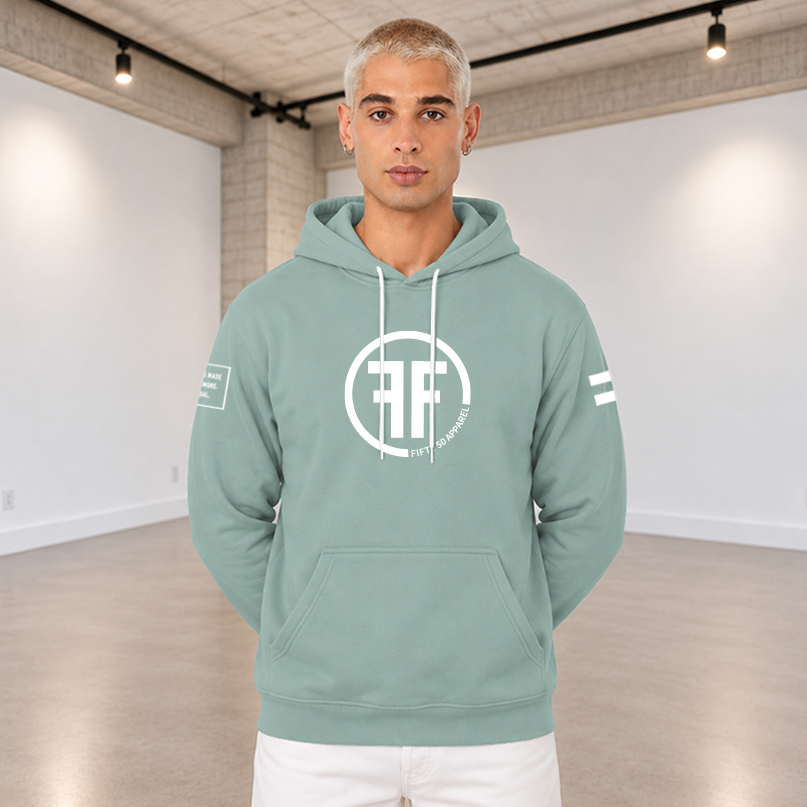 A man wearing adusty green equality hoodie with a white equal sign on left arm, and the text, Fifty 50 Apparel is made for equality, no more, no less, just equal, on the right arm. Center chest logo has two Fs, back to back outlined by a circle.