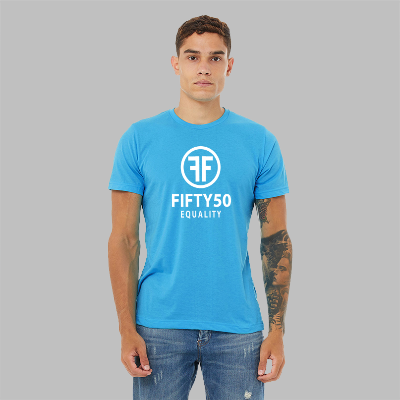 A man wearing a heather turquoise equality t-shirt with a white logo in bold font. There are two Fs, back to back, surrounded by a circle and the text reads, Fifty50 with Equality below it.