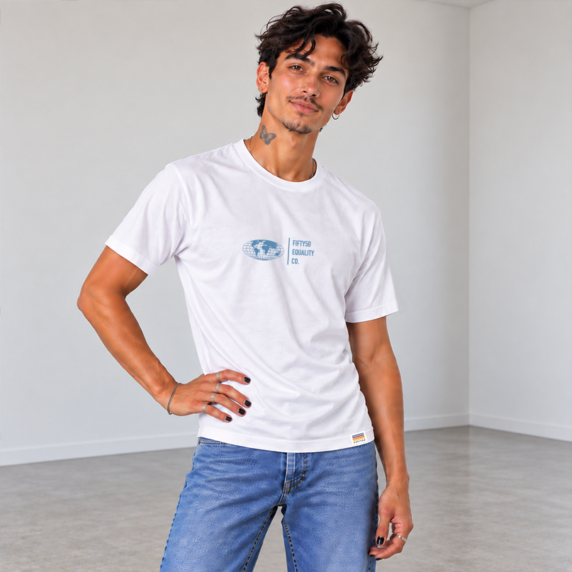 A man wearing a white short-sleeve t-shirt with a Slate Blue graphic center chest featuring a globe and the text 'FIFTY50 EQUALITY CO. Paired with jeans, set against a solid gray background.