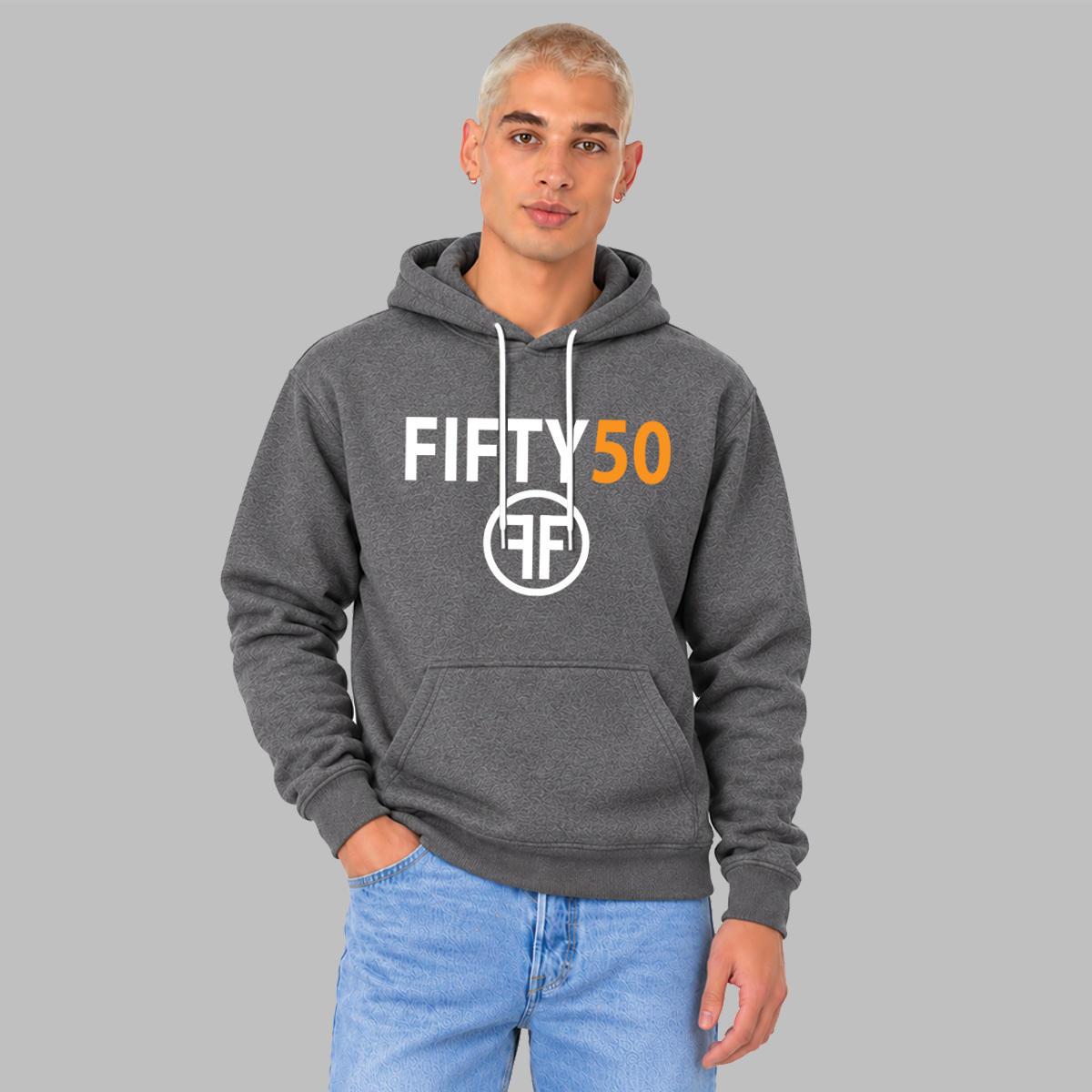 A man wearing a dark gray pullover hoodie with a white and orange 'FIFTY 50' graphic on the chest, paired with light blue jeans, set against a solid gray background.

A man wearing a heather grey pullover hoodie with the text 'Fifty ' in white bold font and the number '50' in orange bold font. Under the text are two white Fs, back to back, surrounded by a circle. 