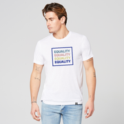 A man wearing a white equality tshirt with the text Equality, stacked four times in a row, in navy blue, Slate Blue, Dusty Rose, and Bisque Gold. The text is in bold font and is outlined by a navy blue square.  