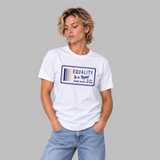 A woman wearing a white graphic t-shirt with a navy, stone blue, pink and yellow design that says 'EQUALITY IS A RIGHT', 'NO MORE NO LESS JUST EQUAL' with a solid gray studio background.