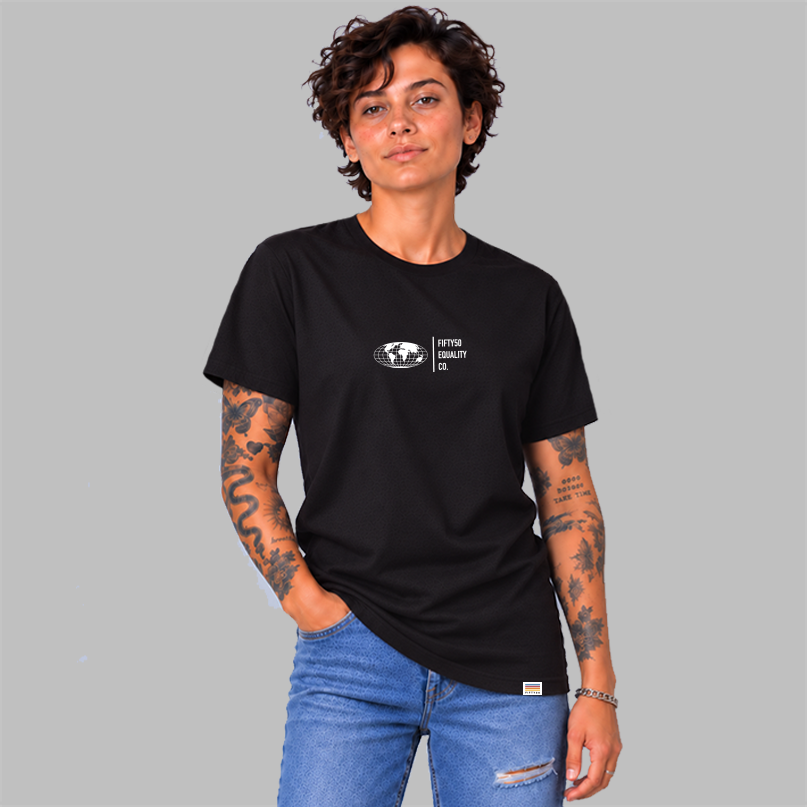 A woman wearing a  black short-sleeve t-shirt with a white graphic center chest featuring a globe and the text 'FIFTY50 EQUALITY CO. Paired with jeans, set against a solid gray background.