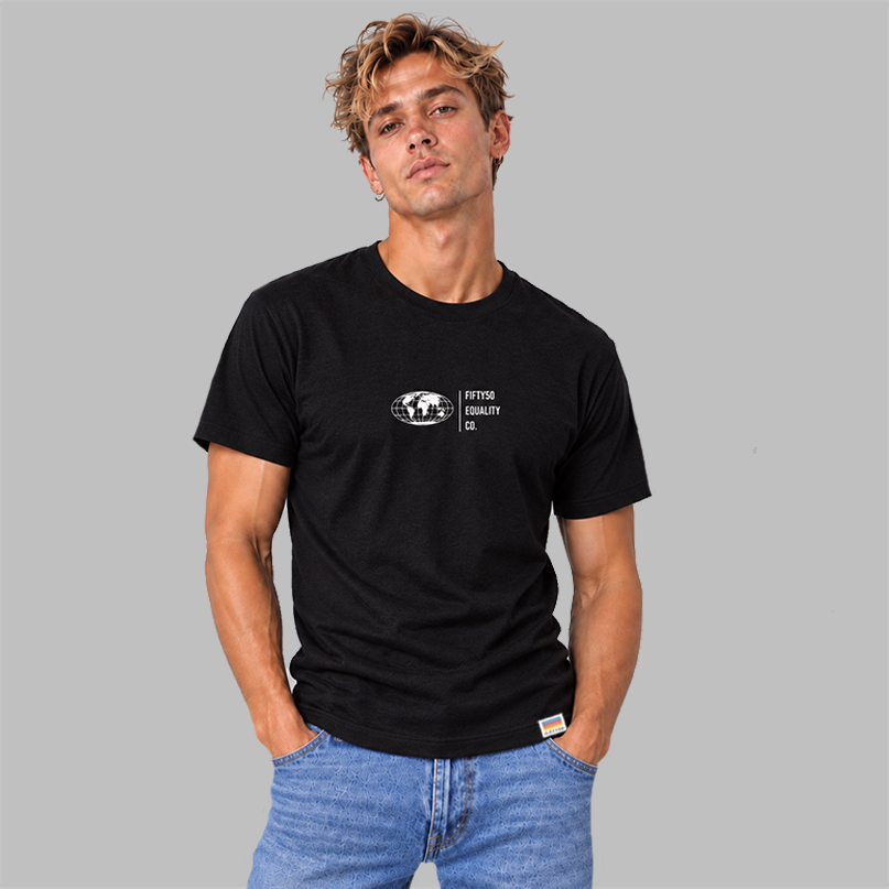 A man wearing a  black short-sleeve t-shirt with a white graphic center chest featuring a globe and the text 'FIFTY50 EQUALITY CO. Paired with jeans, set against a solid gray background.