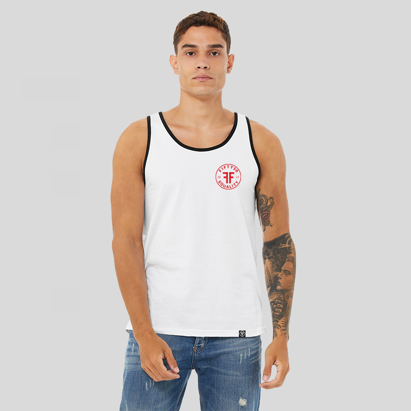 A man wearing a white tank top with black trim. Red left chest logo is round and has the text Fifty 50 at the top and Equality at the bottom with two Fs, back to back in the middle.